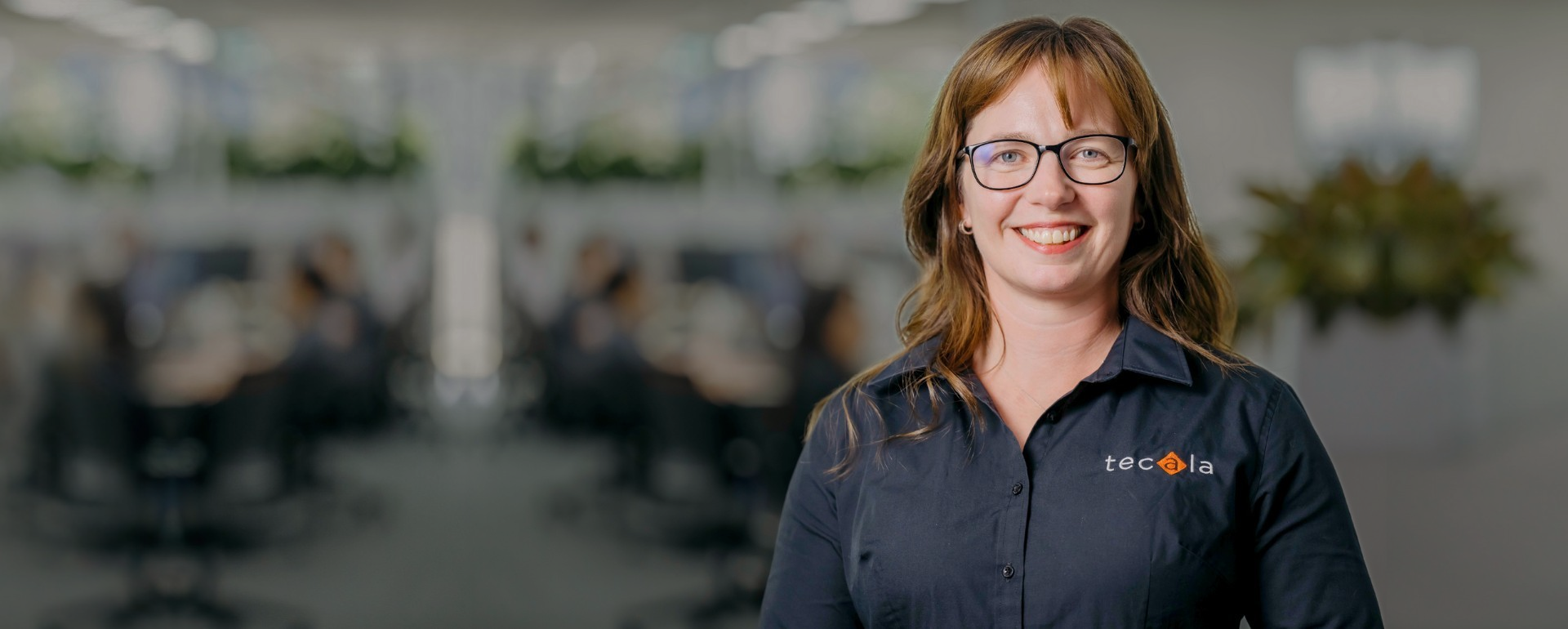 Tecala team member in a modern office, representing expert IT support, cyber security, and managed technology services.