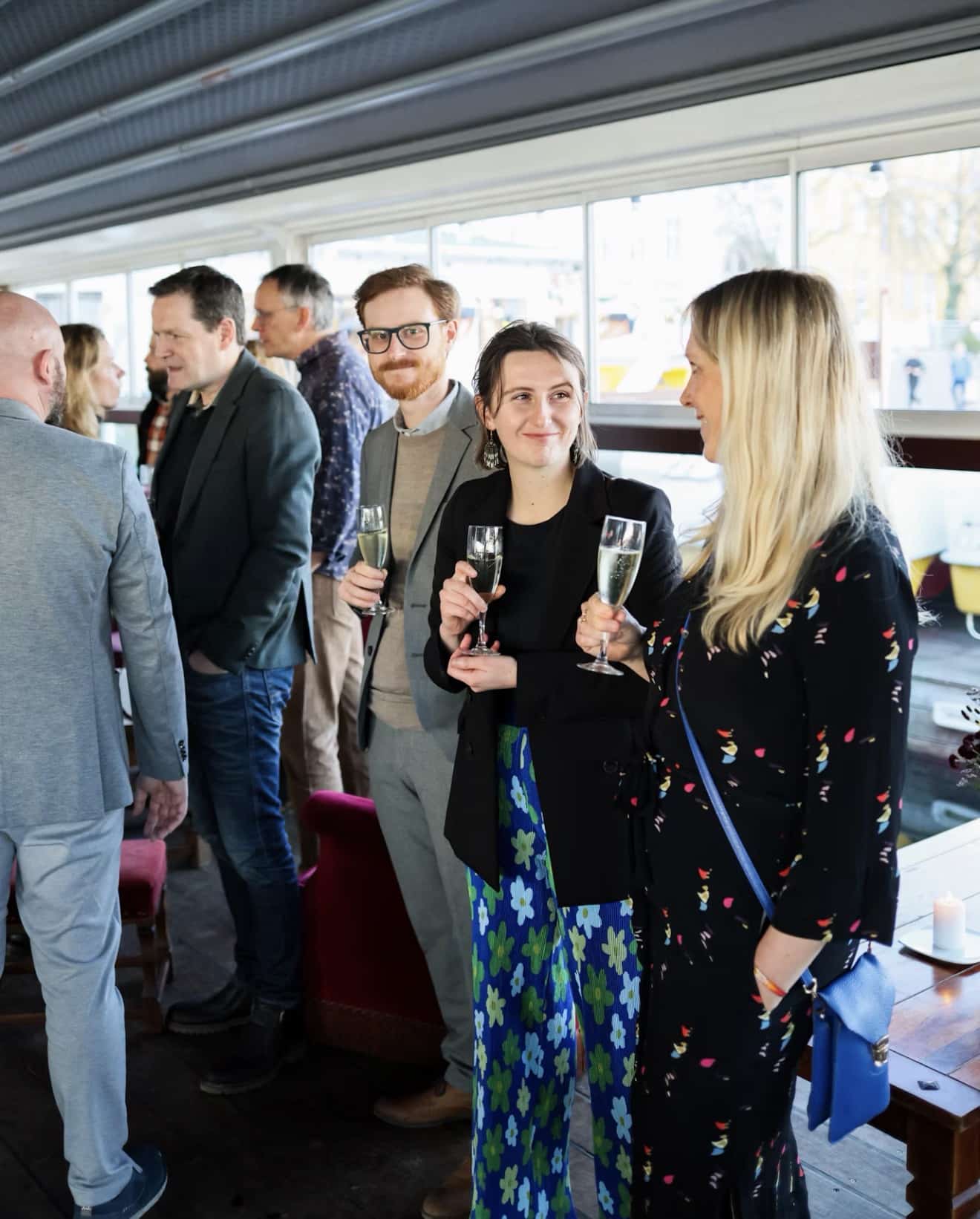 Professionals networking and talking at an evening event